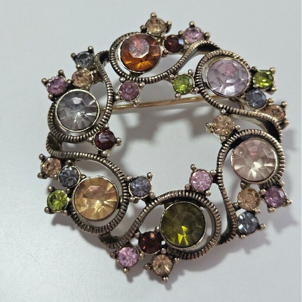 Monet gold tone round brooch